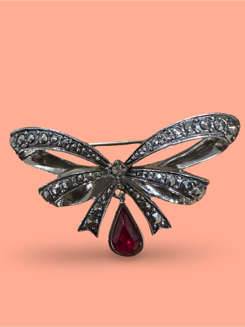 Silver Bow Brooch with Red Teardrop Stone
